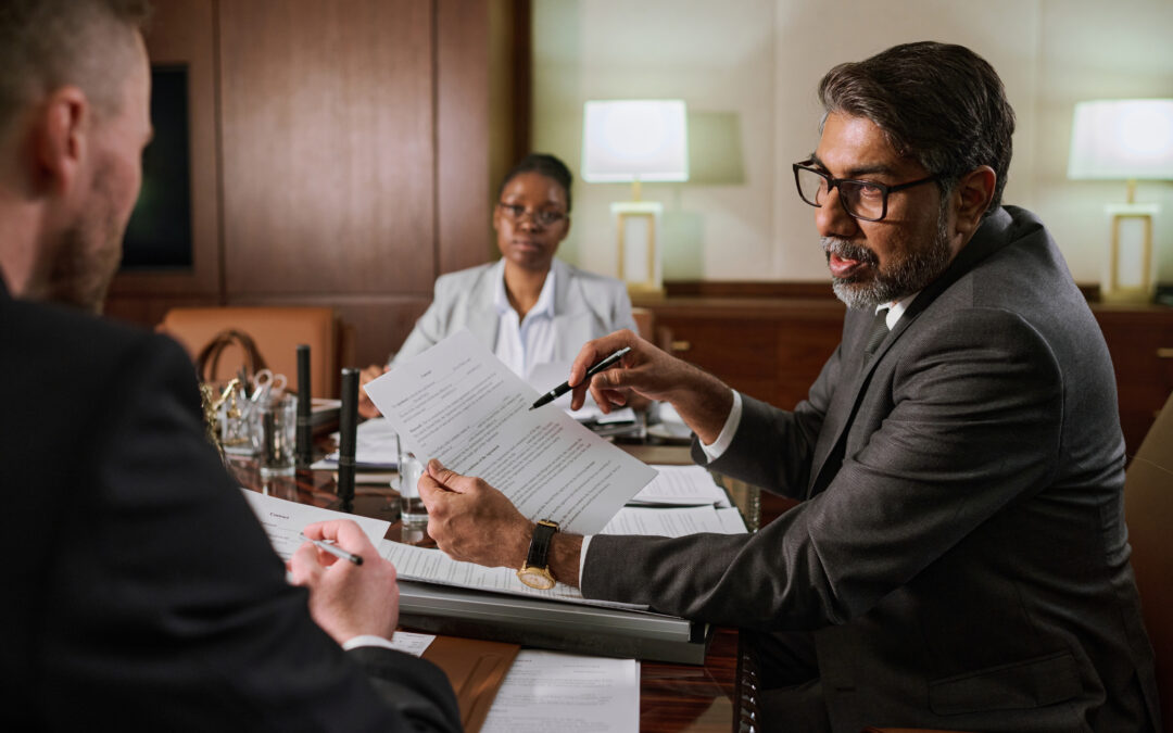 Medical expert with lawyers inside an office
